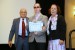 Dr. Nagib Callaos, General Chair, giving Dr. Deisy Mohr Bäuml (accompanied by her son Alessander Bäuml) the best paper award certificate of the session "Sistemas/Tecnologías de Información y sus Aplicaciones II". The title of the awarded paper is "Ambientación Estimuladora para Desarrollo de Competencias Calidad de Vida para Personas com Discapacidad."